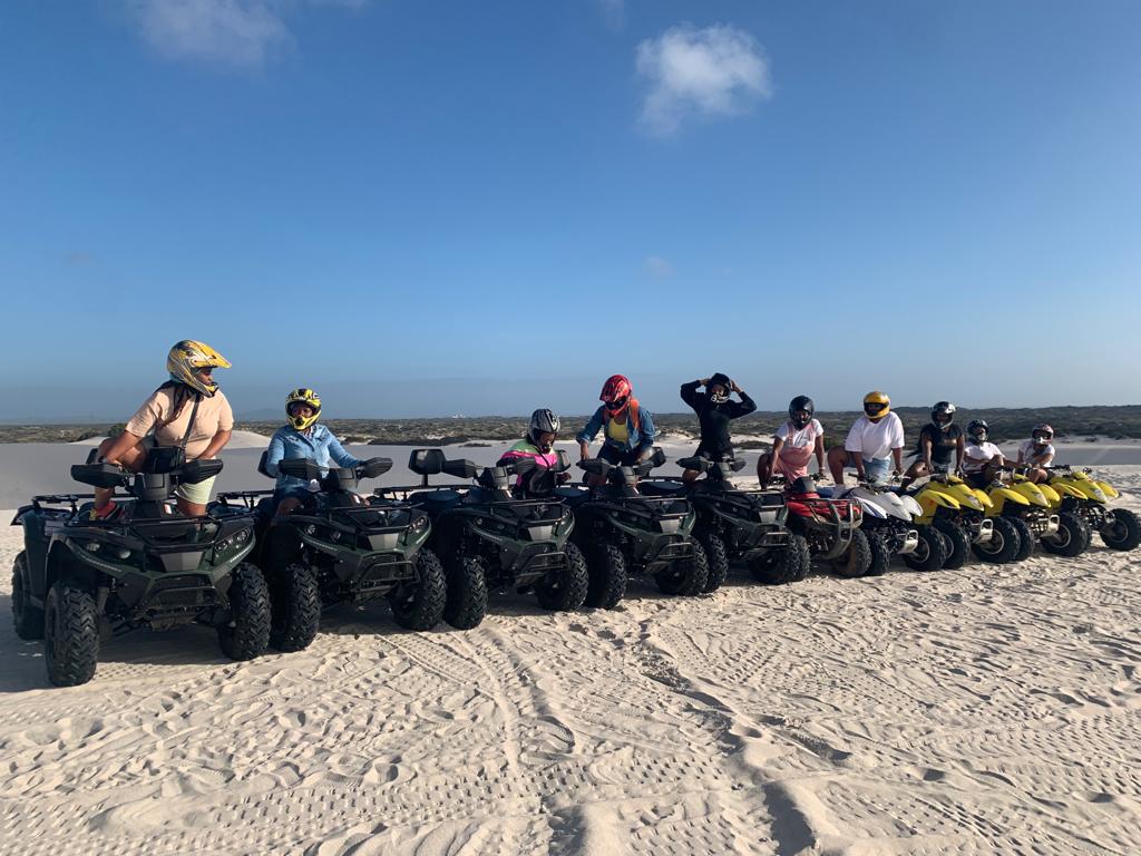 Private quad bike tour rider on a white sand dune at Atlantis, Cape Town